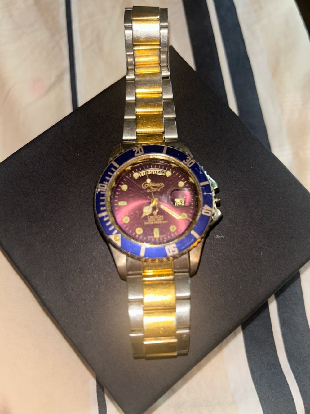 Invicta Two-Tone Gold and Silver Watch with Blue Bezel and Purple Dial